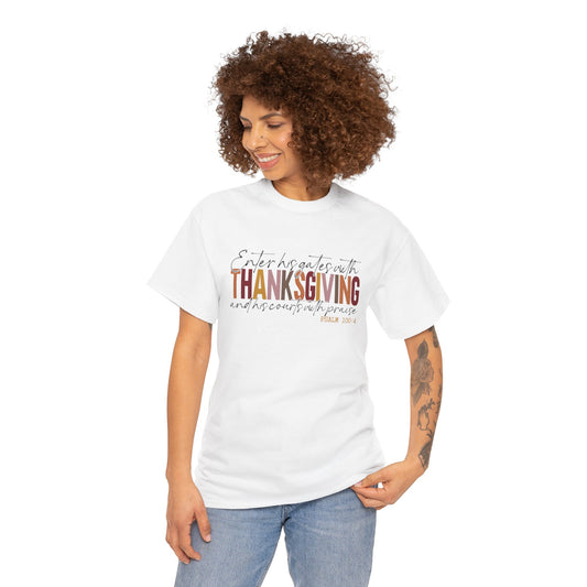 Woman wearing a white t-shirt that reads “Enter His Gates with Thanksgiving – Psalm 100:4,” styled with jeans, Christian faith-inspired fall outfit.