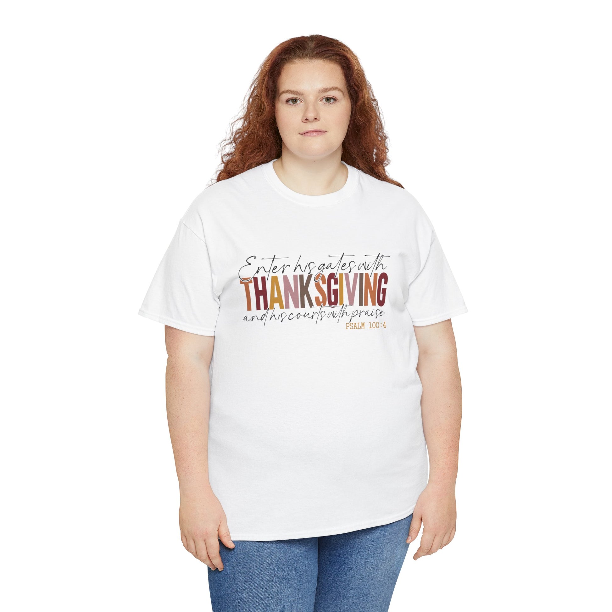 Woman wearing a white t-shirt that reads “Enter His Gates with Thanksgiving – Psalm 100:4,” styled with jeans, Christian faith-inspired fall outfit.